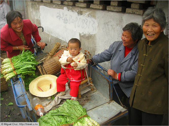 China: Sichuan Province: Showing off the baby