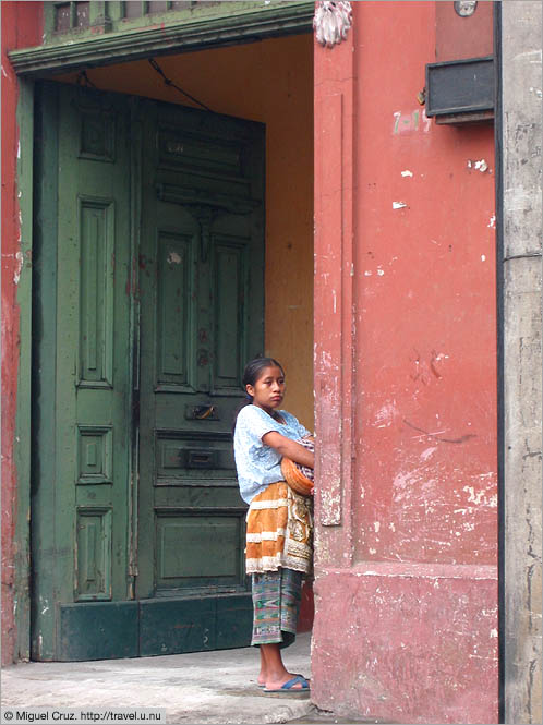 Guatemala: Guatemala City: Girl in doorway