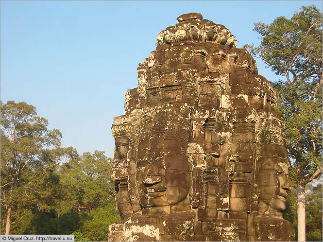 Cambodia: Siem Reap and Angkor Wat: Bayon temple heads basking in the sunshine