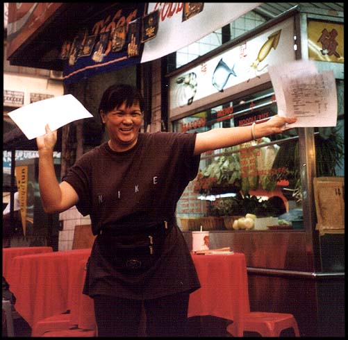 Malaysia: Kuala Lumpur: Manic menu lady