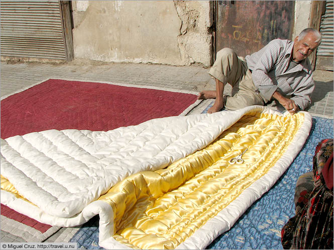 Syria: Damascus: Comfortable comforter merchant