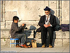 Shoeshine boy and customer